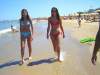 2_girls_walking_on_beach
